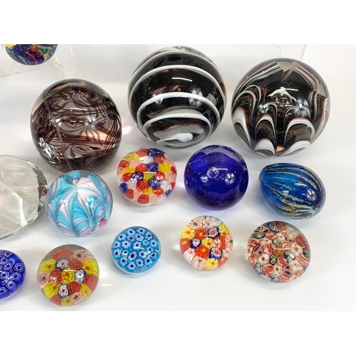 394 - A collection of Art Glass paperweights. Largest 10 x 9cm.