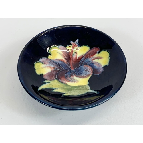 396 - A vintage Moorcroft pottery footed dish. 9cm