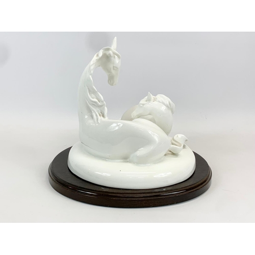 399 - A large Royal Doulton Images “The Gift of Life” pottery horse figure on wooden base. Figure measures... 