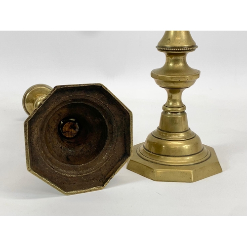 400 - A pair of Victorian brass candlesticks. 27cm