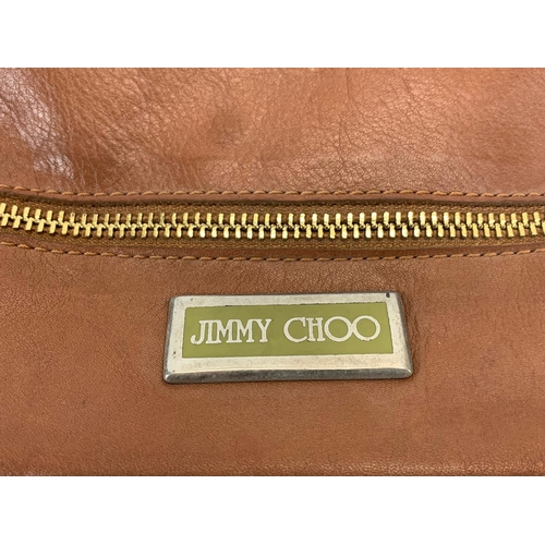 402 - A Jimmy Choo leather ladies bag. 28 x 32cm