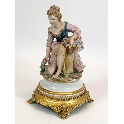 408 - 2 Capodimonti porcelain figurines on ornate brass bases. Tallest measures 28cm