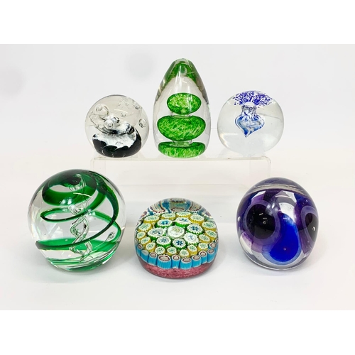 414 - 4 Art Glass paperweights. 9 x 9cm