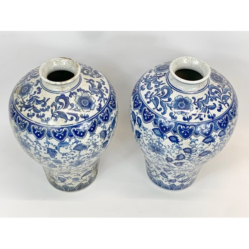 415 - A pair of large vintage Chinese blue and white pottery vases. 26 x 36cm