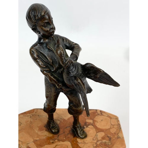 427 - A bronze figure on slate base. 10 x 6 x 17cm