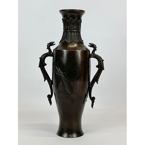 433 - A late 19th century Japanese Bronze vase. 17 x 31cm