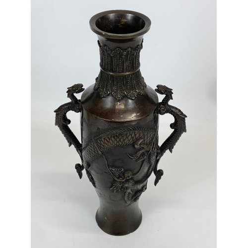 433 - A late 19th century Japanese Bronze vase. 17 x 31cm