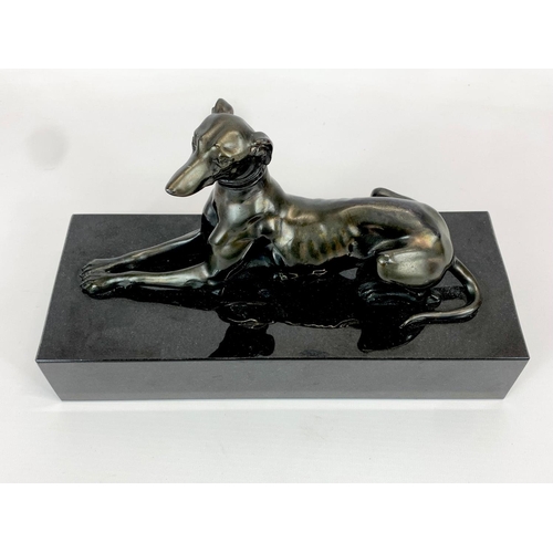 434 - A Bronze Greyhound on heavy slate base. 27 x 11 x 16cm.