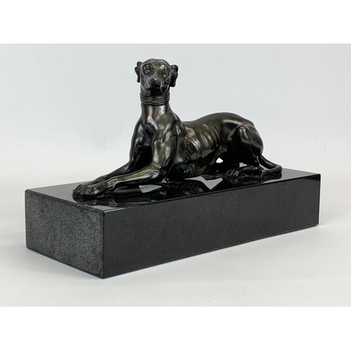 434 - A Bronze Greyhound on heavy slate base. 27 x 11 x 16cm.