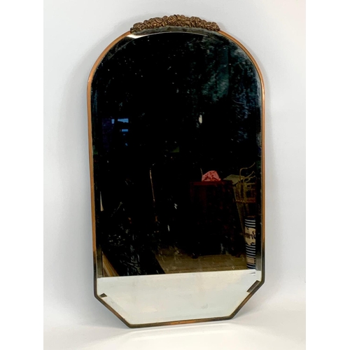 44 - An Edwardian copper framed mirror. 39 x 67.5cm