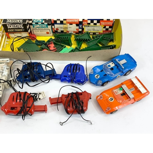 53 - A vintage Scalextric racing set in original box. Including 6 cars, 6 remotes, 3 instruction books an... 