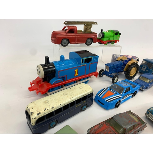 54 - A collection of model cars and trucks. Dinky, Corgi, Lesney.