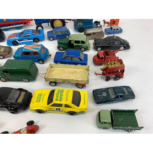 54 - A collection of model cars and trucks. Dinky, Corgi, Lesney.