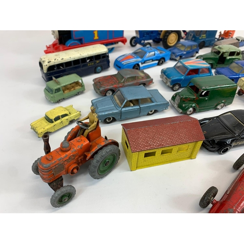 54 - A collection of model cars and trucks. Dinky, Corgi, Lesney.