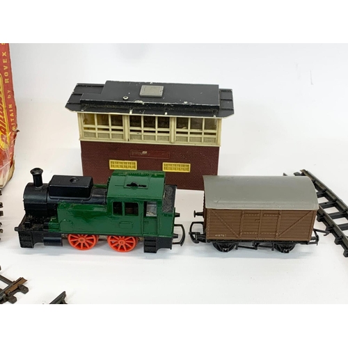 56 - A vintage Triang (Tri-ang) Railways Train Set in original box. Including 2 trains, 3 carts, tracks e... 