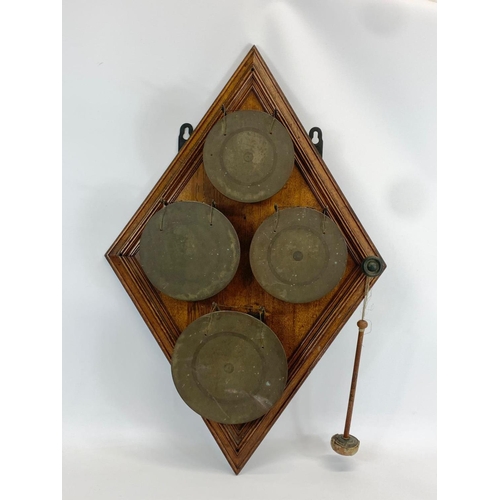 66 - A large late 19th century wall mounted bronze gong on oak frame. 58 x 89cm.