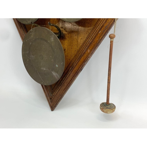 66 - A large late 19th century wall mounted bronze gong on oak frame. 58 x 89cm.