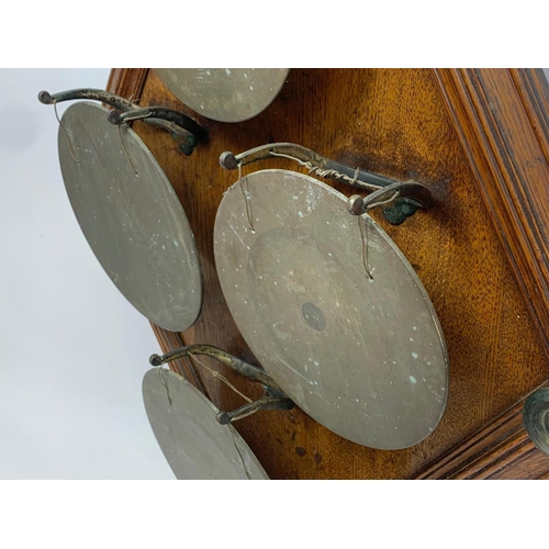 66 - A large late 19th century wall mounted bronze gong on oak frame. 58 x 89cm.