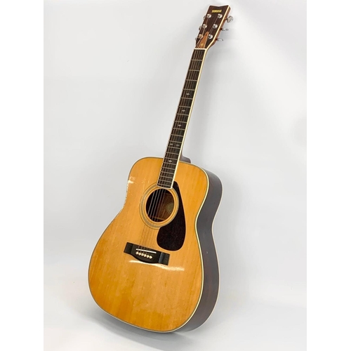 67 - A guitar by Yamaha. FG 345. 103cm