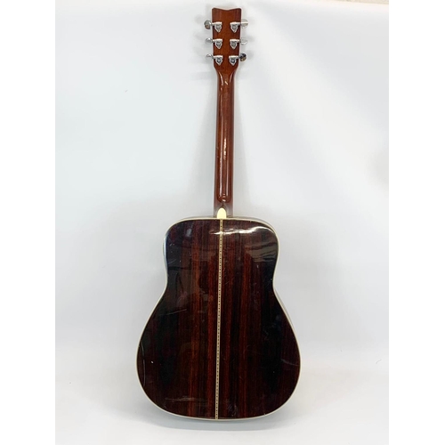 67 - A guitar by Yamaha. FG 345. 103cm