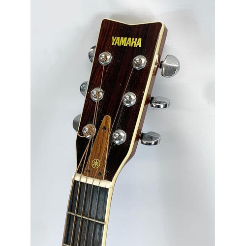 67 - A guitar by Yamaha. FG 345. 103cm