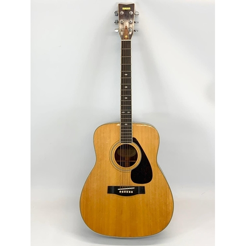 67 - A guitar by Yamaha. FG 345. 103cm