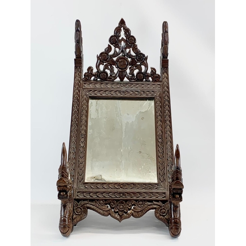 75 - A large vintage heavily carved Burmese style dressing mirror. 35 x 42 x 72cm