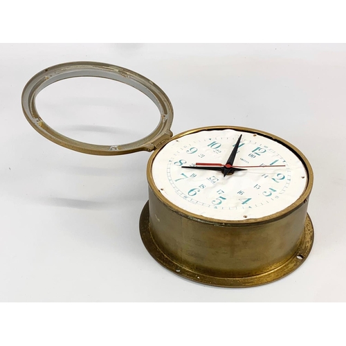 78 - A vintage Smiths brass Bulkhead Ships Clock. Battery. 19 x 9cm