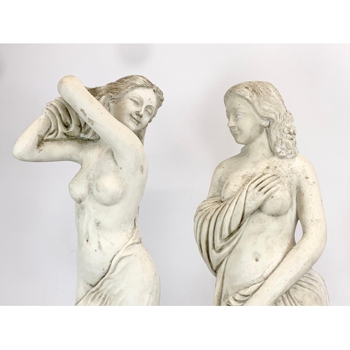 83 - A pair of large heavy plaster figurines. 63cm