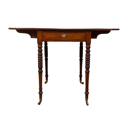 933 - A Victorian mahogany Pembroke drop leaf table with drawer and brass cup casters. Open 106 x 84 x 73.... 