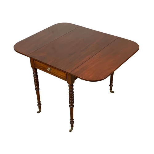 933 - A Victorian mahogany Pembroke drop leaf table with drawer and brass cup casters. Open 106 x 84 x 73.... 