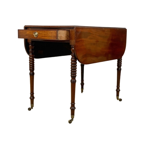 933 - A Victorian mahogany Pembroke drop leaf table with drawer and brass cup casters. Open 106 x 84 x 73.... 