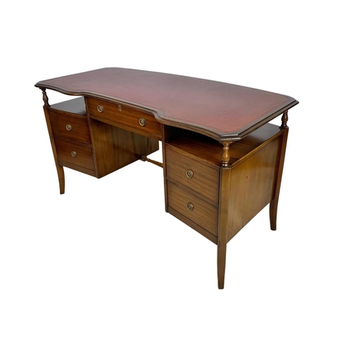 1085 - Mahogany leather top writing desk. 138 x 66 x 76.5cm