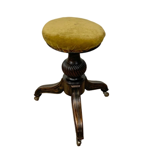 1090 - A Victorian mahogany piano stool, in the George IV style.