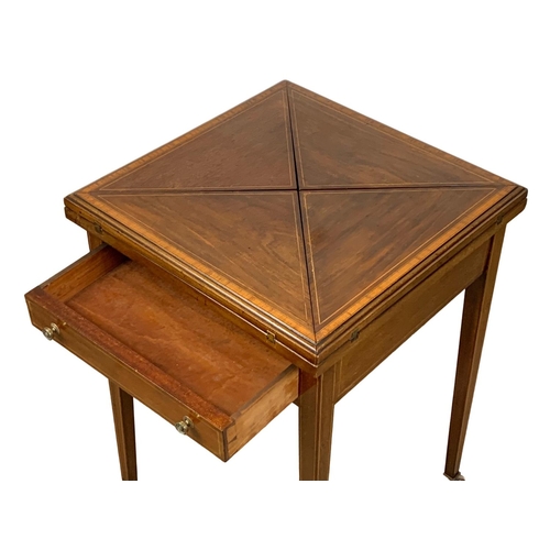 1092 - An Edwardian inlaid mahogany envelope games table. 51 x 51 x 74.5cm