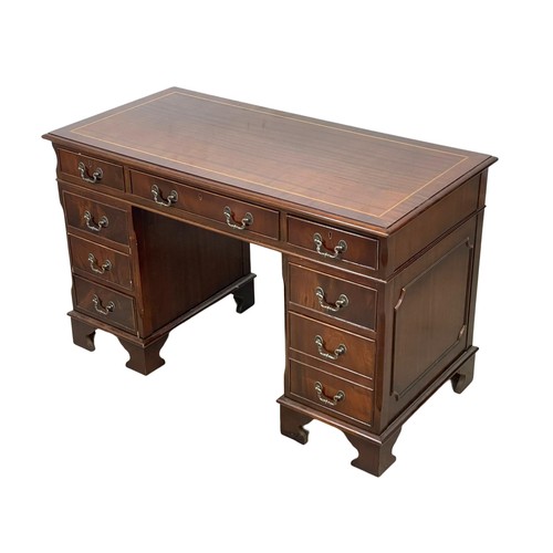 1088 - A Georgian style inlaid mahogany pedestal writing desk. 124 x 62 x 77.5cm