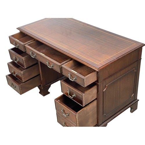 1088 - A Georgian style inlaid mahogany pedestal writing desk. 124 x 62 x 77.5cm