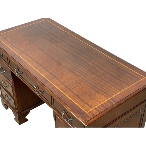 1088 - A Georgian style inlaid mahogany pedestal writing desk. 124 x 62 x 77.5cm