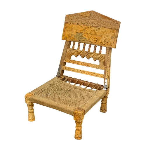 1094 - An Afghan folding chair.