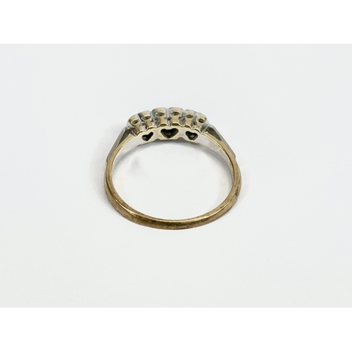 525 - A ladies 9ct gold and diamond ring. Size L. 2.3 grams.