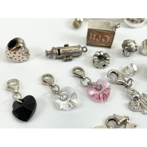 534 - A quantity of silver charms and a silver Links London bracelet.