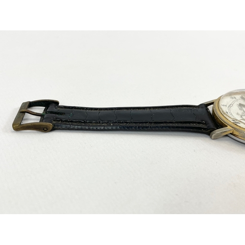 592 - A vintage gents Mortima De Luxe watch.