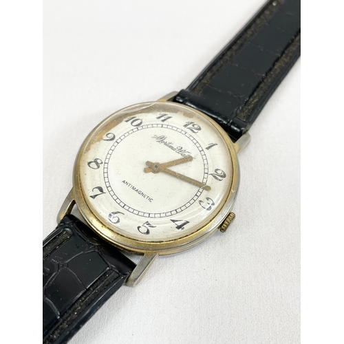 592 - A vintage gents Mortima De Luxe watch.