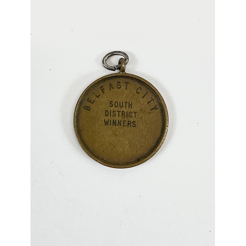 39 - A 1950 U.S.C (Ulster Special Constabulary) shooting medal. Belfast City south District Winners.