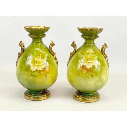 421 - A pair of Royal Bonn porcelain urns, with hand painted flower and gilding decoration. Germany. Circa... 