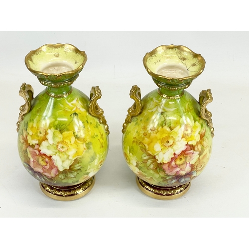 421 - A pair of Royal Bonn porcelain urns, with hand painted flower and gilding decoration. Germany. Circa... 