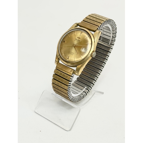 546 - A vintage Audax Aquaprufe gold plated watch.