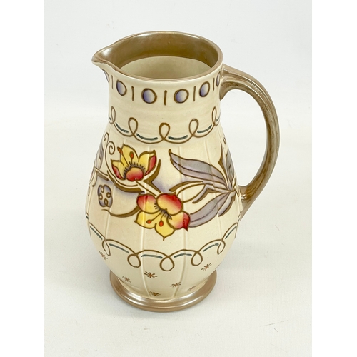 422 - A Charlotte Rhead jug designed for Bursley Ware. 653. 1930’s. 22cm