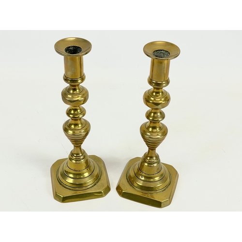 429 - A pair of Victorian brass candlesticks. 22cm