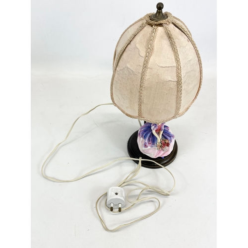 443 - A Royal Doulton pottery figure lamp. 36cm including shade.